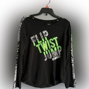 This is a cute, gymnastics long-sleeve shirt. Great for a sporty young girl!